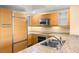 Modern kitchen with stainless steel appliances, granite countertops, and wooden cabinetry at 222 Karen Ave # 1702, Las Vegas, NV 89109