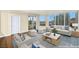 This stylish living room features a modern sofa, plush seating, and expansive windows with cityscape views at 222 Karen Ave # 1702, Las Vegas, NV 89109