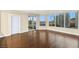 Spacious living room with floor-to-ceiling windows offering city views, and sleek wood flooring at 222 Karen Ave # 1702, Las Vegas, NV 89109