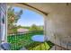 Balcony view with table, chairs, and view of nature at 2325 Windmill Pkwy # 1622, Henderson, NV 89074