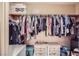 Walk-in closet with ample storage and LG monitor on top shelf at 2325 Windmill Pkwy # 1622, Henderson, NV 89074