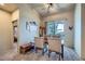 Bright dining room with modern furniture and a sliding glass door to an outdoor balcony at 2325 Windmill Pkwy # 1622, Henderson, NV 89074