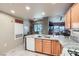 View of the kitchen with stainless steel appliances, island, and granite countertops at 2325 Windmill Pkwy # 1622, Henderson, NV 89074