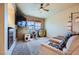 Relaxing living room features comfortable seating, a wall-mounted TV, and bright windows at 2325 Windmill Pkwy # 1622, Henderson, NV 89074