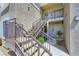 Exterior stairway with metal railings, leading to upper-level condo units at 2325 Windmill Pkwy # 1622, Henderson, NV 89074