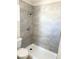Updated bathroom featuring tiled walls and a walk-in shower at 236 Pershing Dr, Las Vegas, NV 89107