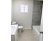 Bathroom with new toilet, vanity, and tiled shower-tub combo at 236 Pershing Dr, Las Vegas, NV 89107