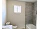 A modern bathroom featuring a shower-tub combination and stylish tile work at 236 Pershing Dr, Las Vegas, NV 89107