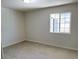 Bedroom featuring a light color scheme with a window providing natural light at 236 Pershing Dr, Las Vegas, NV 89107