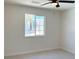 A cozy bedroom with natural light, tile floors, and a ceiling fan at 236 Pershing Dr, Las Vegas, NV 89107