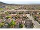 Residential aerial shows homes with pools, solar panels, and desert landscaping in a suburban neighborhood at 249 Cinnamon Ridge Way, Henderson, NV 89015