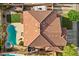 An aerial view of the roof showing a backyard with a pool, patio furniture and well-maintained desert landscaping at 249 Cinnamon Ridge Way, Henderson, NV 89015