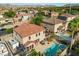 Aerial shot shows the backyard with a pool, well maintained landscape and a patio perfect for gatherings at 249 Cinnamon Ridge Way, Henderson, NV 89015