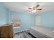 Bedroom with hardwood floors, a double bed, a ceiling fan, and a dresser at 249 Cinnamon Ridge Way, Henderson, NV 89015
