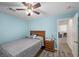 Bedroom featuring hardwood floors, a bed, a ceiling fan, and access to the rest of the home at 249 Cinnamon Ridge Way, Henderson, NV 89015