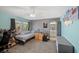 Cozy bedroom with a twin bed, dresser, and view of the outside. Bathroom is accessible from the bedroom at 249 Cinnamon Ridge Way, Henderson, NV 89015