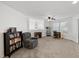 Large carpeted bonus area includes a sitting area, a desk, and natural light at 249 Cinnamon Ridge Way, Henderson, NV 89015