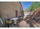 Side yard featuring an air conditioning unit, utility area, and side access gate at 249 Cinnamon Ridge Way, Henderson, NV 89015