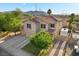 Aerial view of a lovely two-story home boasting a three-car garage and gated RV parking at 249 Cinnamon Ridge Way, Henderson, NV 89015