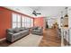 Comfortable living room with a ceiling fan and wood-look flooring at 249 Cinnamon Ridge Way, Henderson, NV 89015