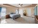 Large main bedroom with trey ceilings, carpet flooring, and ample natural light at 249 Cinnamon Ridge Way, Henderson, NV 89015