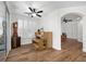 Home office boasts hardwood floors, natural light, plantation shutters, and a unique clock at 249 Cinnamon Ridge Way, Henderson, NV 89015