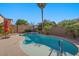 Close-up of the backyard pool and spa, surrounded by lush landscaping and a patio area at 249 Cinnamon Ridge Way, Henderson, NV 89015