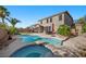 Backyard features a refreshing pool and spa area, perfect for outdoor relaxation and entertainment at 249 Cinnamon Ridge Way, Henderson, NV 89015