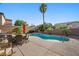 Backyard pool area with lush landscaping, a patio, and a relaxing spa at 249 Cinnamon Ridge Way, Henderson, NV 89015