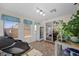 Sunroom showcasing tiled floors, lots of windows, a beverage fridge, and indoor greenery at 249 Cinnamon Ridge Way, Henderson, NV 89015
