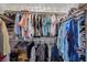 Walk-in closet features organized storage with shelves and hanging rods at 249 Cinnamon Ridge Way, Henderson, NV 89015