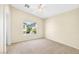 Bedroom with carpet, ceiling fan, a large window, and great light at 2558 Lazy Saddle Dr, Henderson, NV 89002