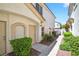 Inviting townhome entrance with charming front door, walkway, and garden at 2558 Lazy Saddle Dr, Henderson, NV 89002
