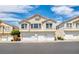 Attractive townhome showcases a private garages, enhancing curb appeal at 2558 Lazy Saddle Dr, Henderson, NV 89002