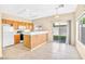 Well-lit kitchen area featuring a breakfast bar and sliding glass door to the yard at 2558 Lazy Saddle Dr, Henderson, NV 89002