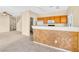 Eat-in kitchen featuring a breakfast bar and view into the living room area at 2558 Lazy Saddle Dr, Henderson, NV 89002