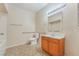 Bathroom features a vanity, mirror, and updated fixtures, plus accessibility bars, in neutral color palette at 2615 W Gary Ave # 1053, Las Vegas, NV 89123