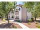 Attractive condo building showcasing neat landscaping, stair access, and building number for easy navigation at 2615 W Gary Ave # 1053, Las Vegas, NV 89123