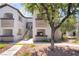 Charming condo building featuring a well-kept exterior, stair access, and lovely tree-lined surroundings at 2615 W Gary Ave # 1053, Las Vegas, NV 89123