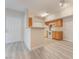 Efficient kitchen boasts wooden cabinets, a breakfast bar, and modern white appliances for easy meal prep at 2615 W Gary Ave # 1053, Las Vegas, NV 89123