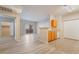 Open living area connected to the kitchen, complemented by wood-style flooring and sliding glass door access at 2615 W Gary Ave # 1053, Las Vegas, NV 89123