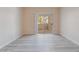 Sunlit living room with pristine flooring and a sliding glass door that leads to an outdoor area at 2615 W Gary Ave # 1053, Las Vegas, NV 89123