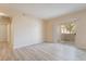 Bright, airy living room featuring sleek flooring and sliding glass doors to the outdoors at 2615 W Gary Ave # 1053, Las Vegas, NV 89123