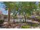 Community pool area offers a peaceful retreat with mature trees and landscaping at 2615 W Gary Ave # 1053, Las Vegas, NV 89123