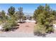 Charming single-story home with desert landscaping and a circular driveway at 2950 Winchester Ave, Pahrump, NV 89048