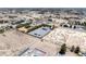 Bird's eye view of property featuring the home, outbuildings, and desert landscape at 2950 Winchester Ave, Pahrump, NV 89048