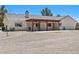 Expansive backyard with a covered patio, ideal for outdoor entertaining at 2950 Winchester Ave, Pahrump, NV 89048