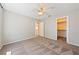Spacious bedroom boasts neutral paint, carpet, ceiling fan, and a walk-in closet at 2950 Winchester Ave, Pahrump, NV 89048