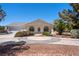 Beautiful single-story home featuring desert landscaping and a three-car garage at 2950 Winchester Ave, Pahrump, NV 89048