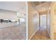 Hallway leading to bathroom and kitchen features tile floors and arched doorway at 2950 Winchester Ave, Pahrump, NV 89048